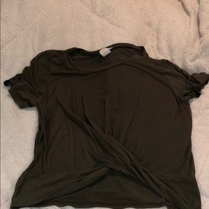 Green top with a cross in the front